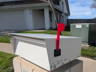 Mailbox flag with larger mounting hole