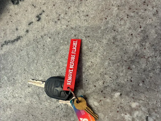 Remove before flight keychain