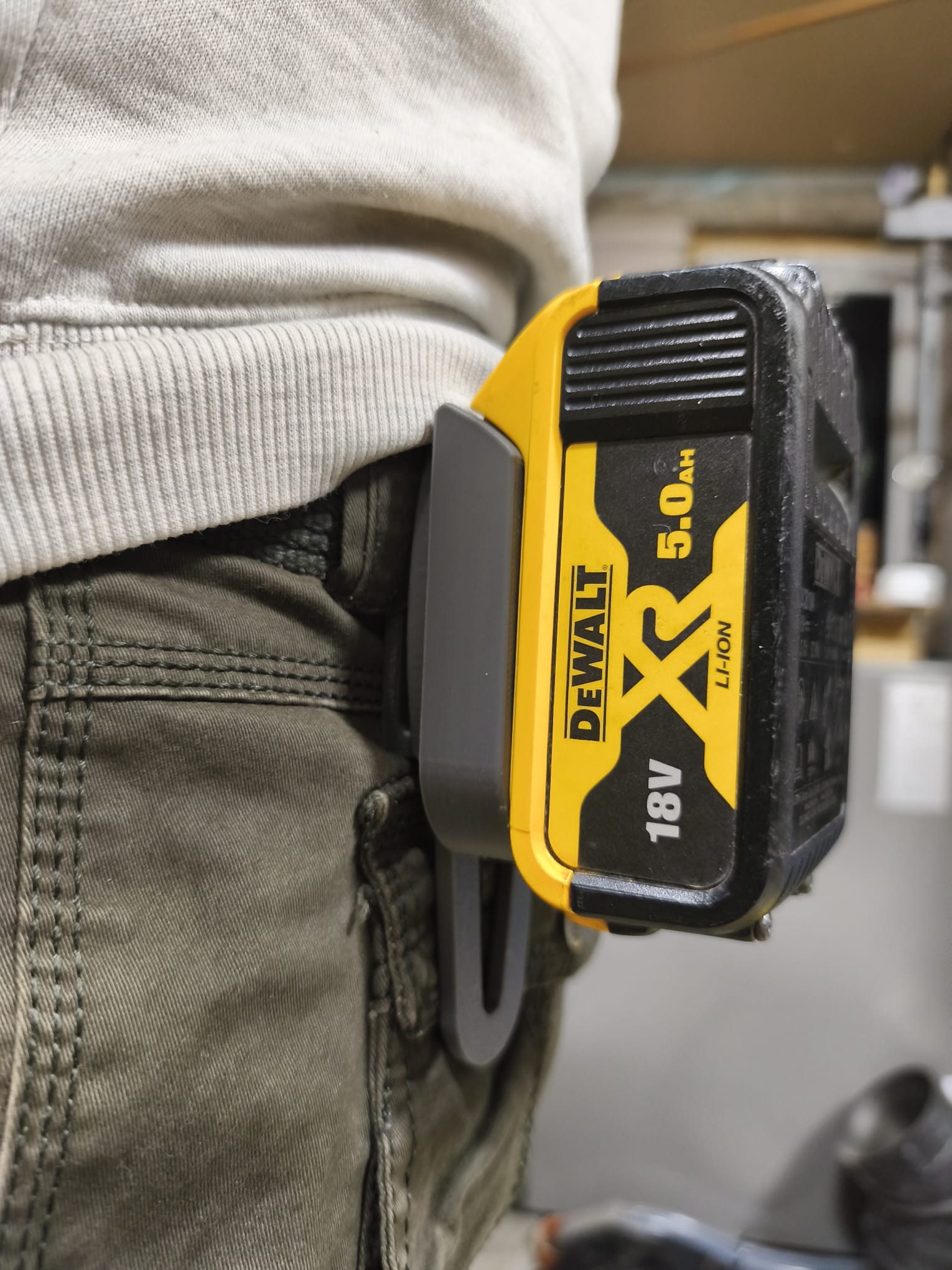 Belt-mounted battery holder