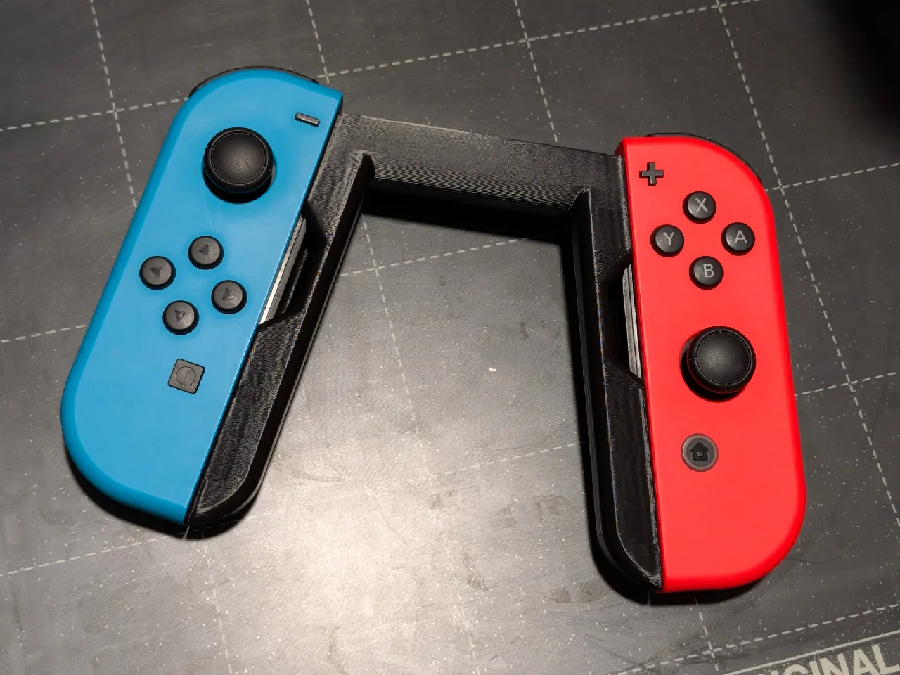 Nintendo Switch Joycon Grip (No Supports) by itsthejoker