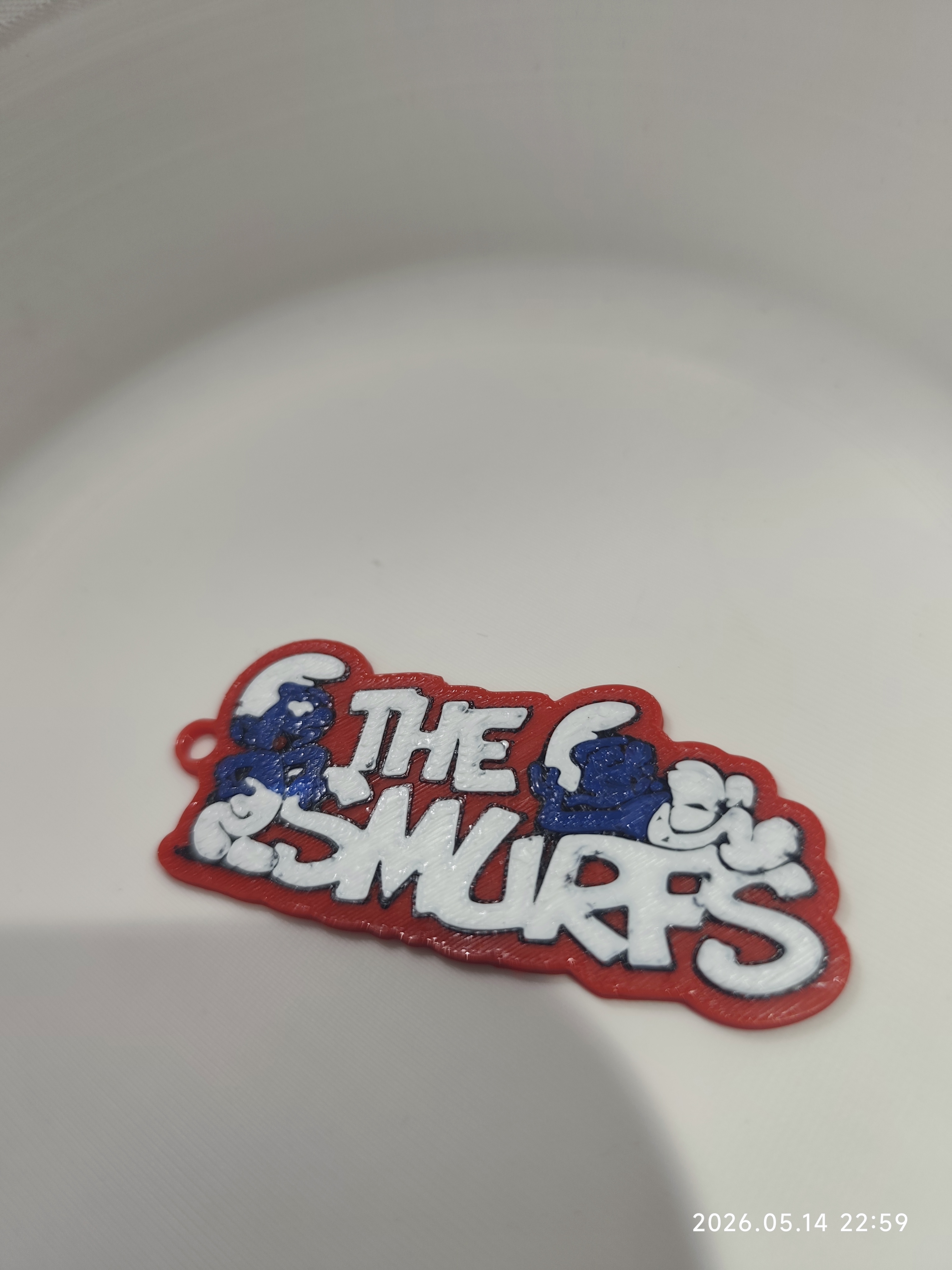 The Smurfs logo keychain