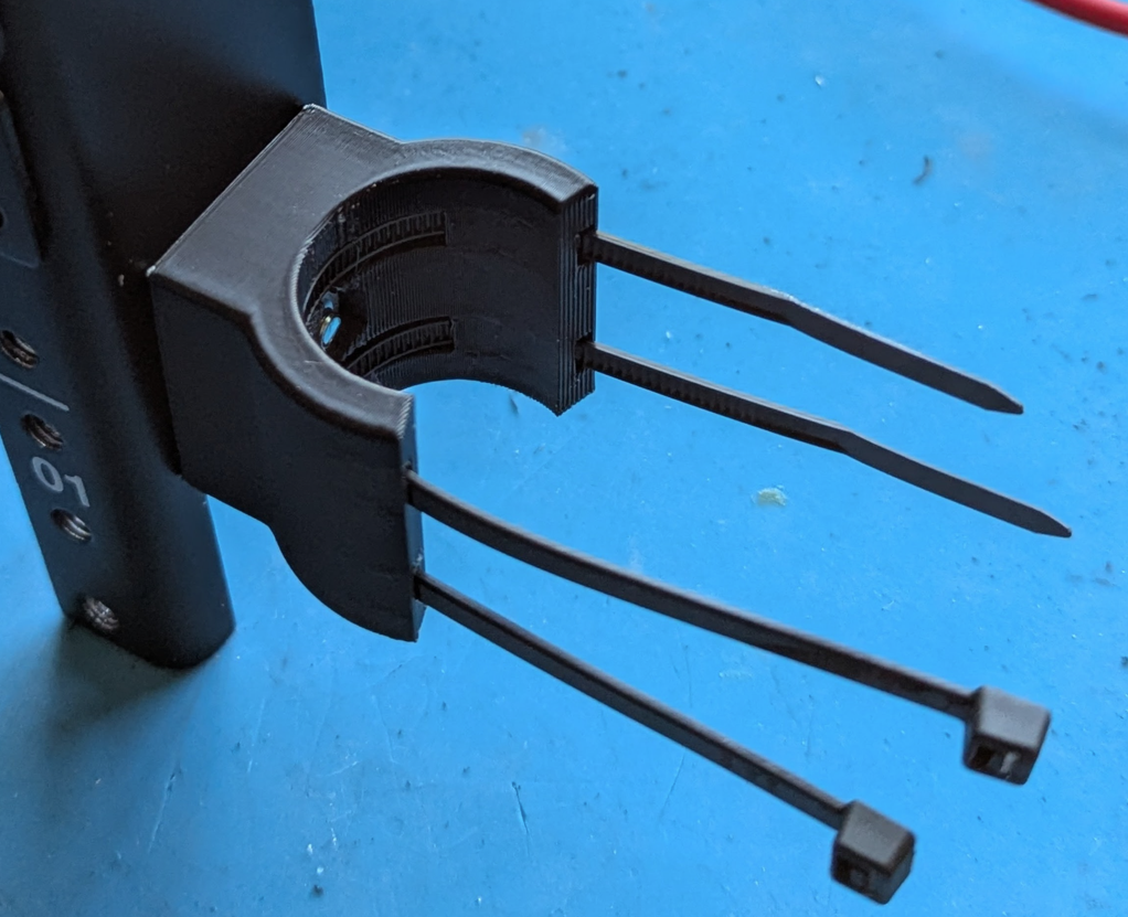 Wireshelf pole bracket with captured nut and zip ties