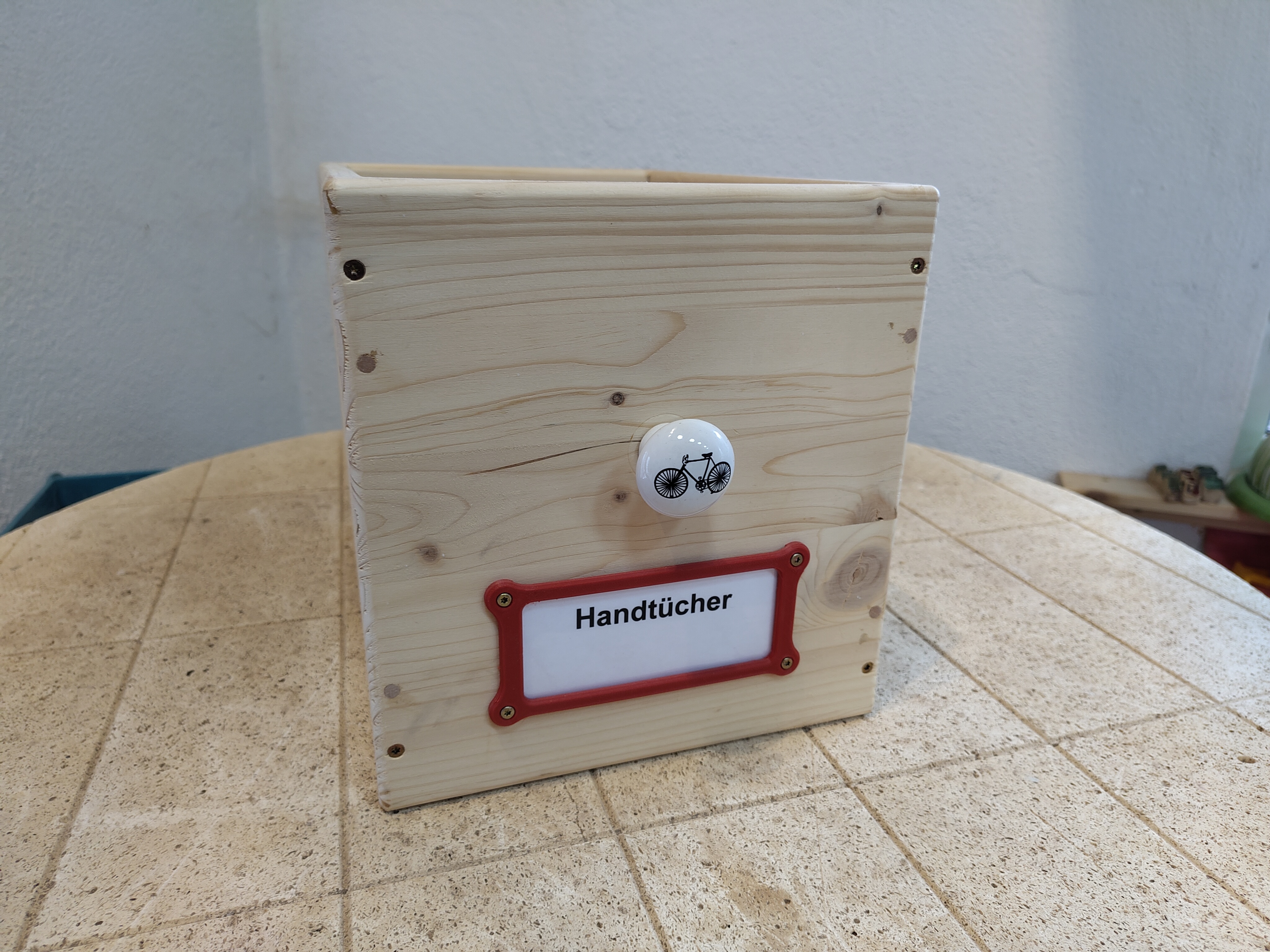 Label bracket for screwing (onto a wooden box for example)