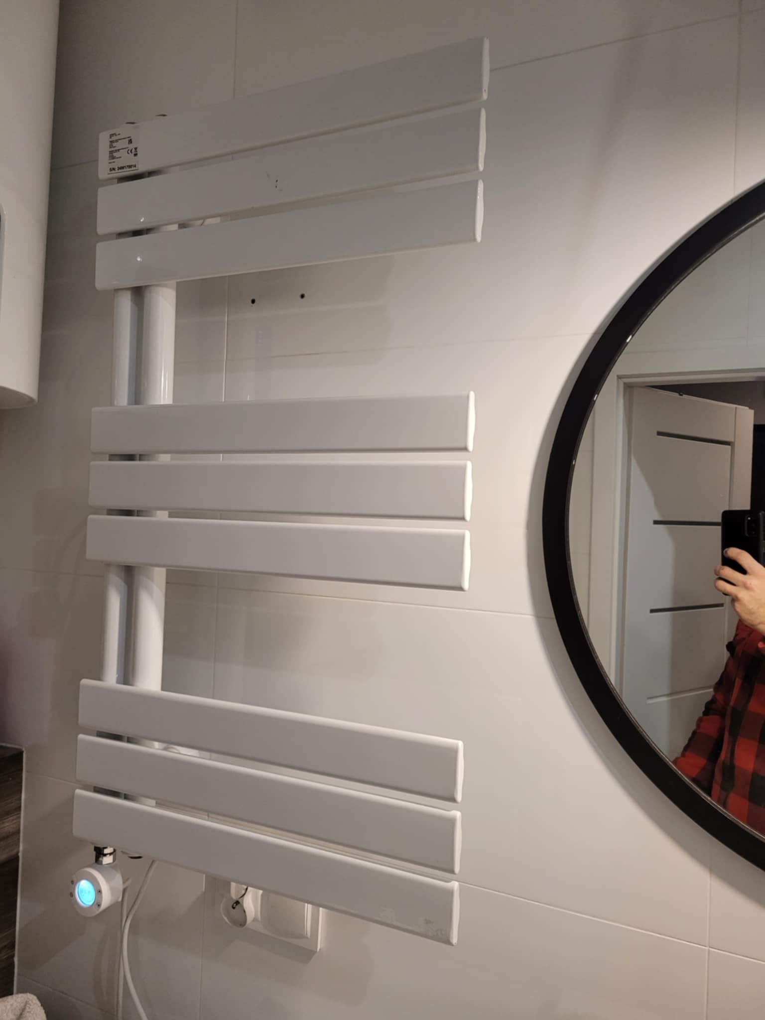 mounting for an electric bathroom radiator
