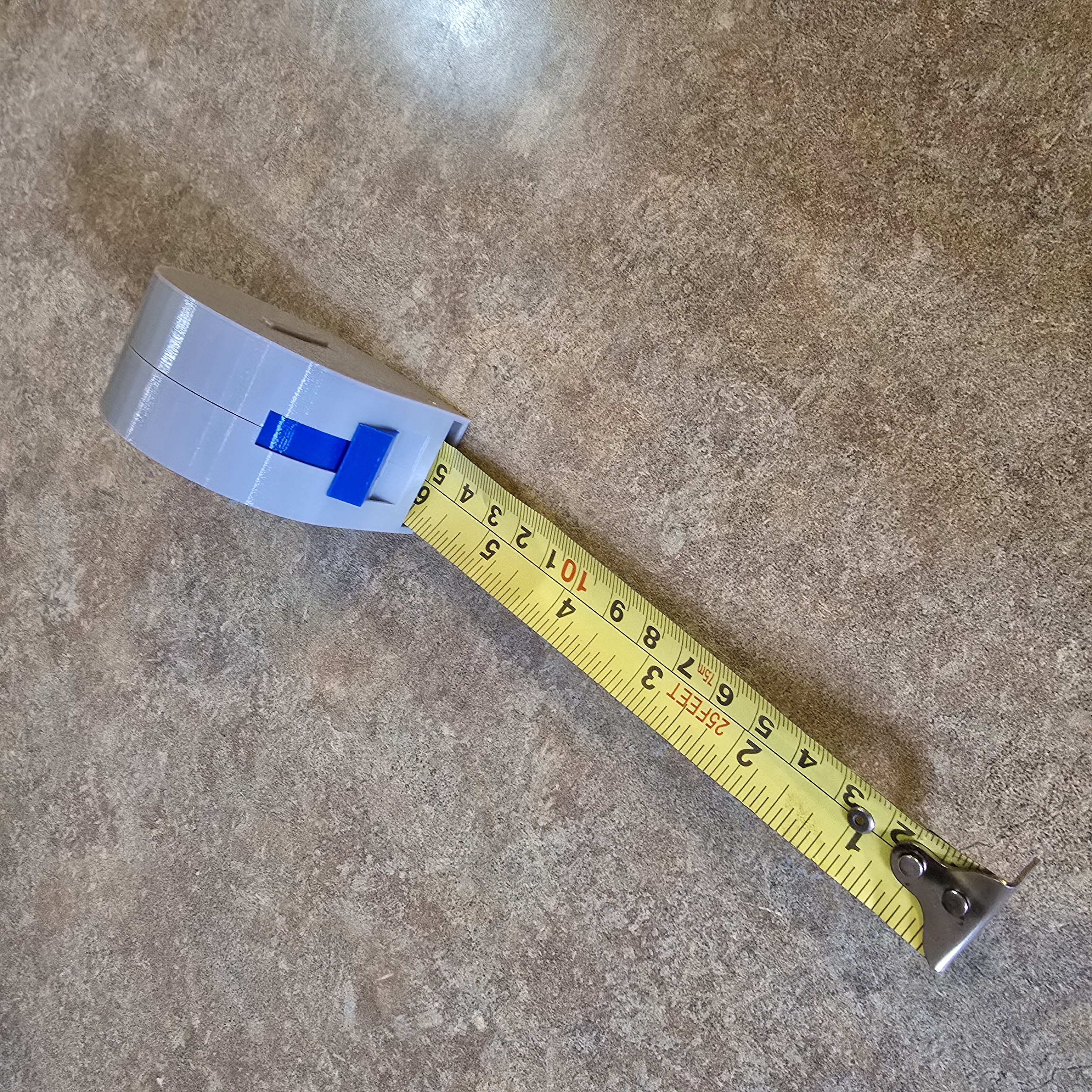 A simple but effective replacement case for a tape measure spool
