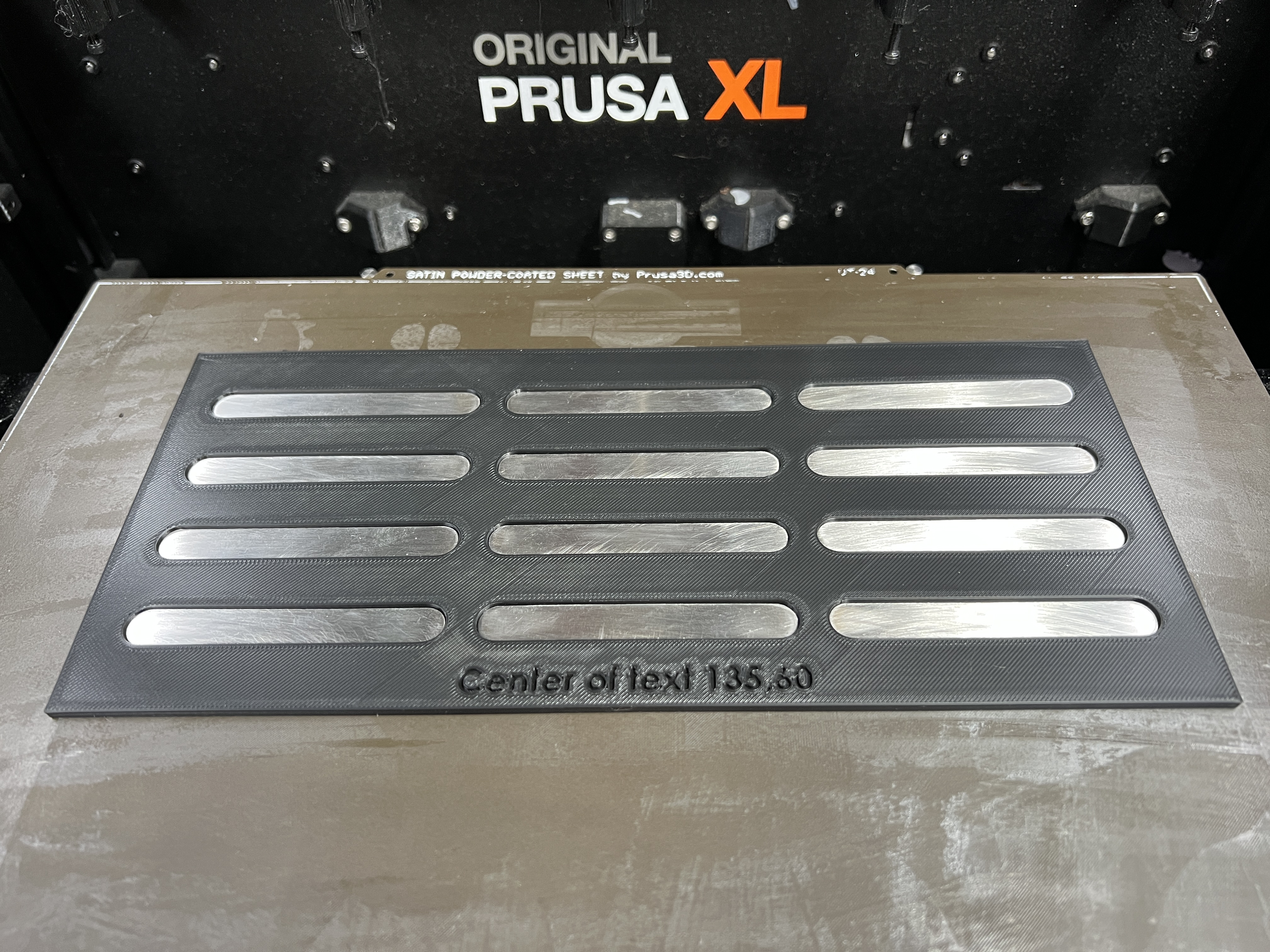 Laser etching jig for stainless tags.