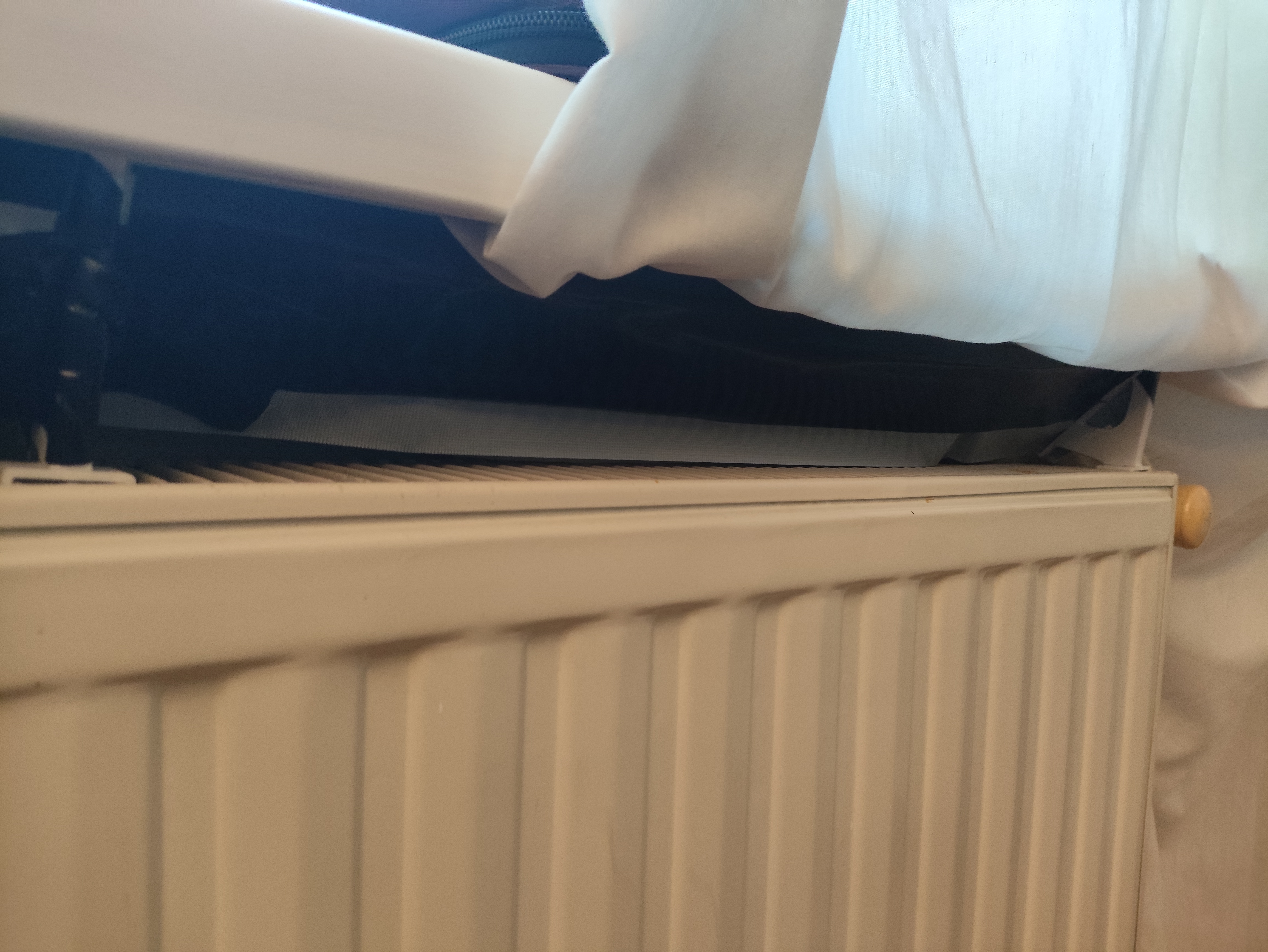 Curtain holder for radiator (heater) with clip