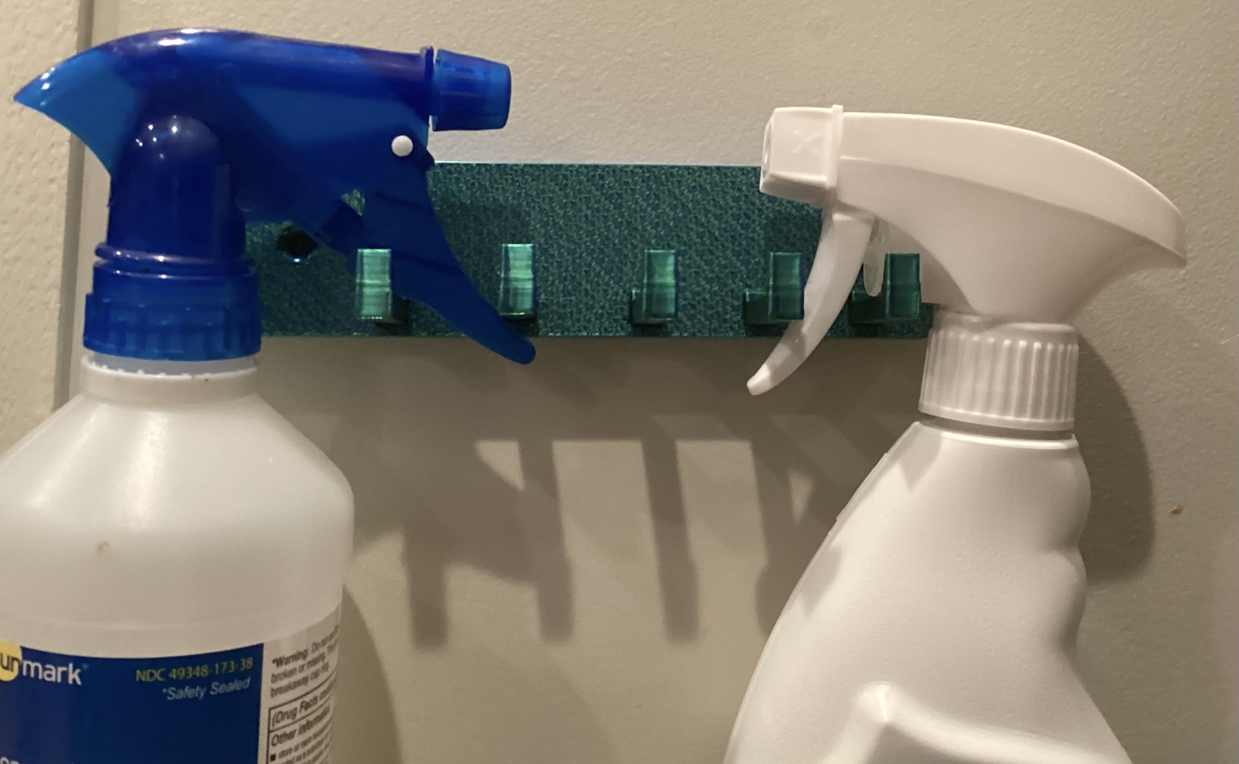 Expandable Hook System for detergent bottles/towels etc.