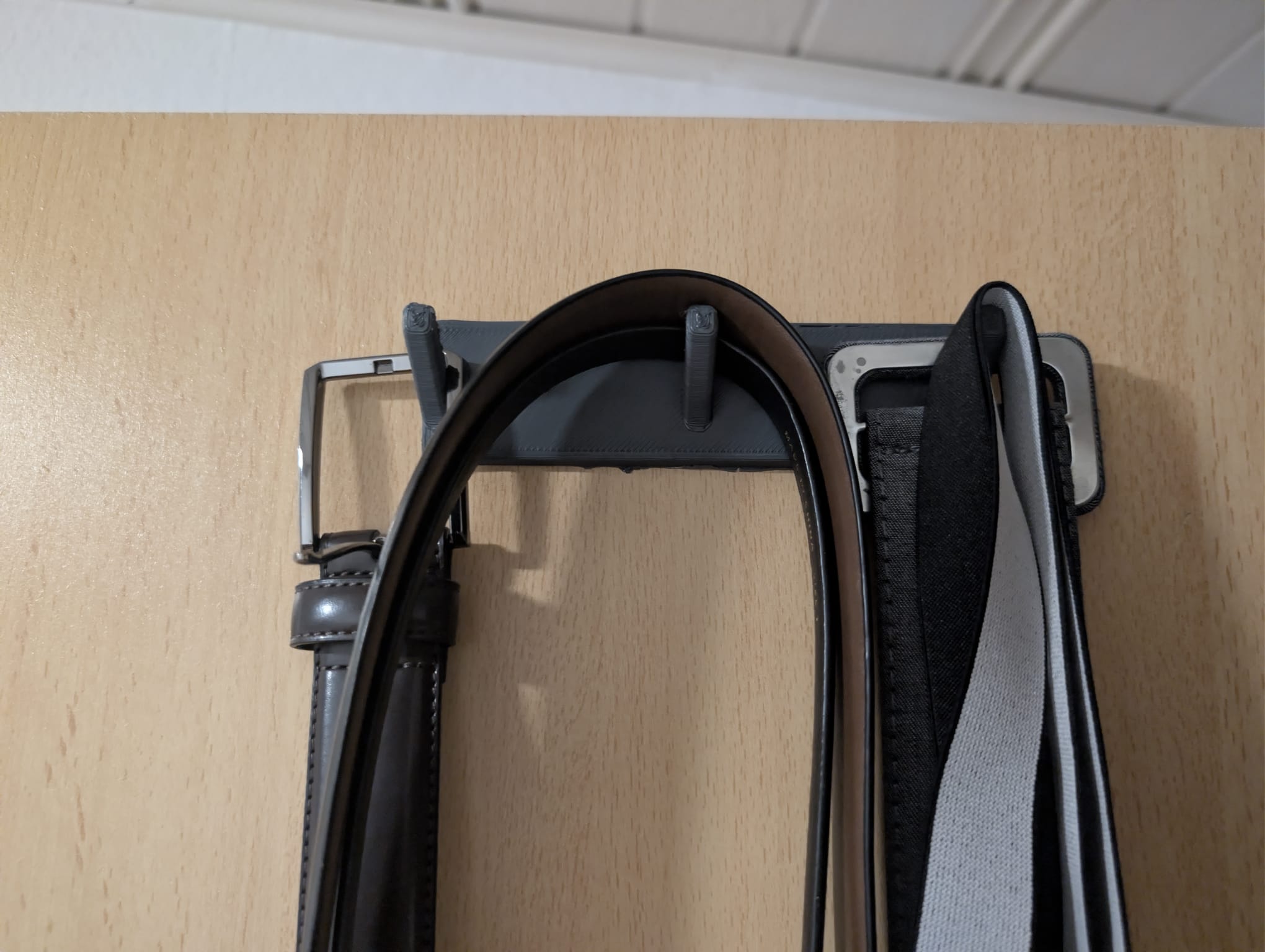 Simple adhesive hook.