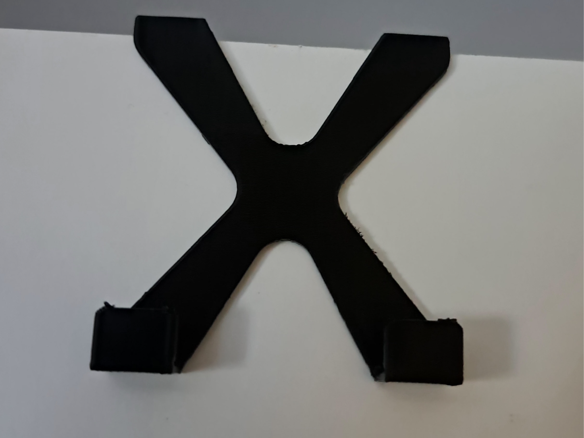 Simple and functional X-shaped wall hook