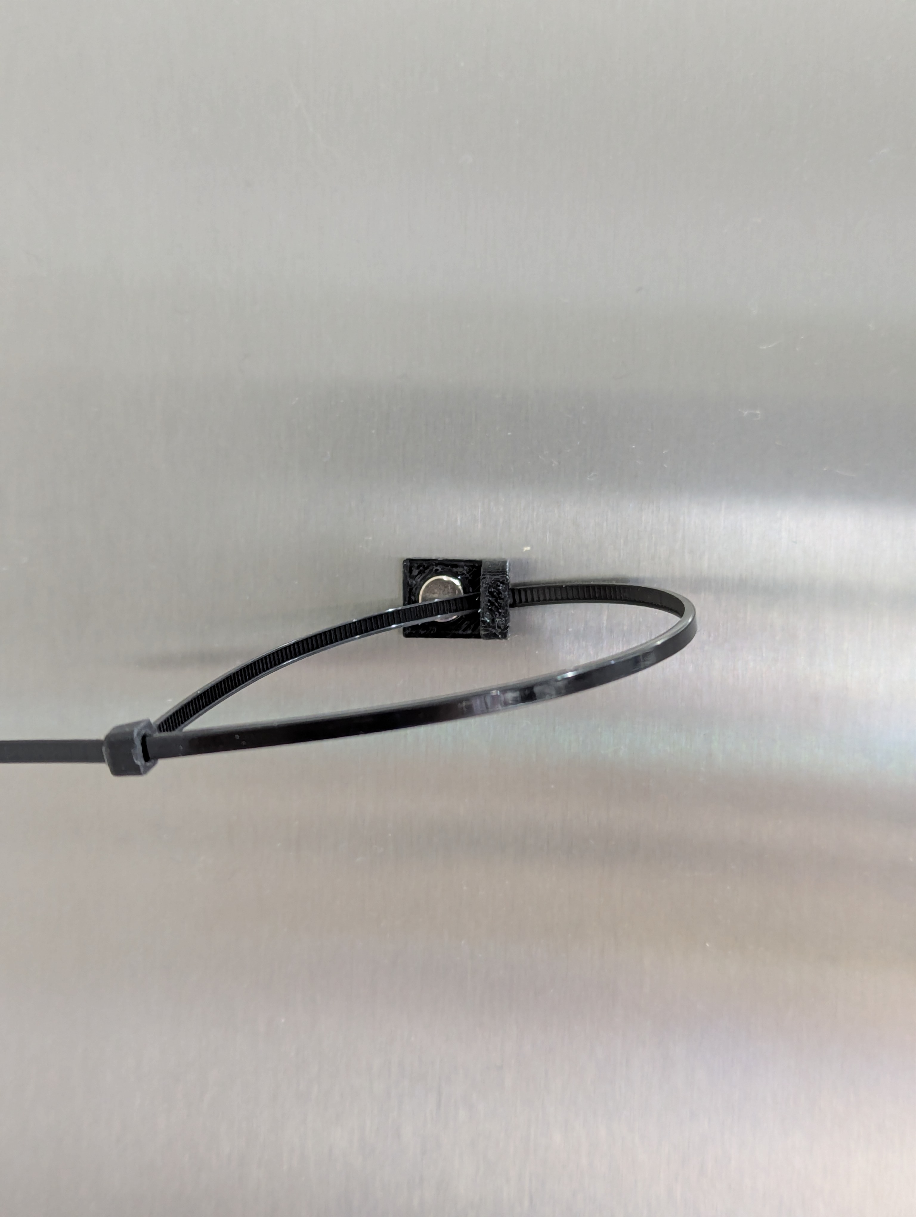 Magnetic zip tie mount (for Prusa Core One)