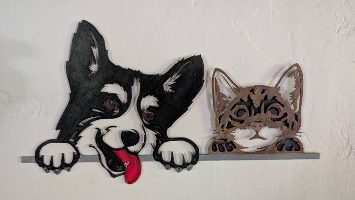 Border Collie and Cat Looking Over Fence Silhouette